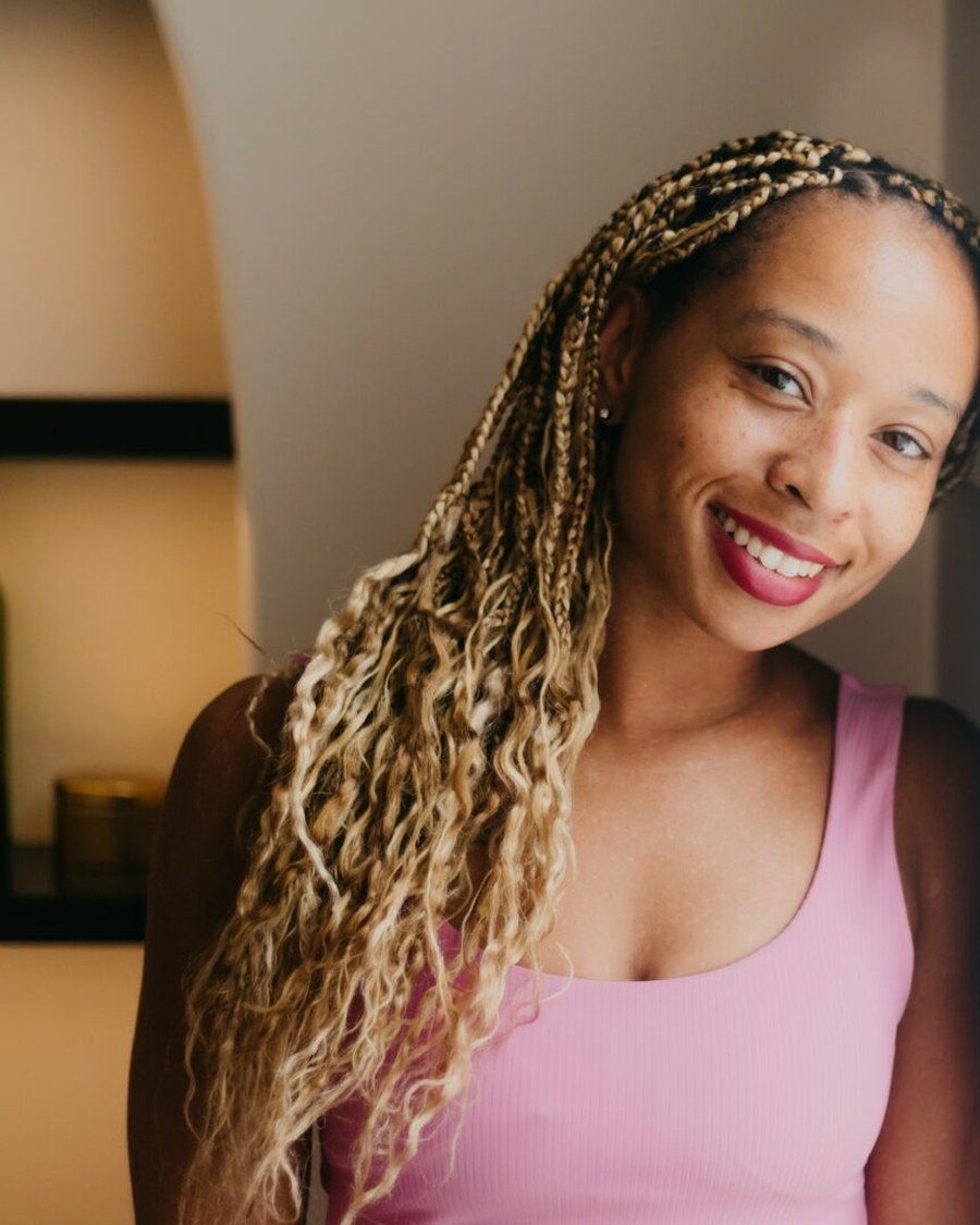 Portrait of Clarissa Shepherd smiling in warm light